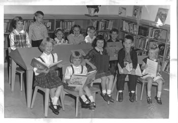 Black and white photo of young children during Picture Book Time at the Melville Library