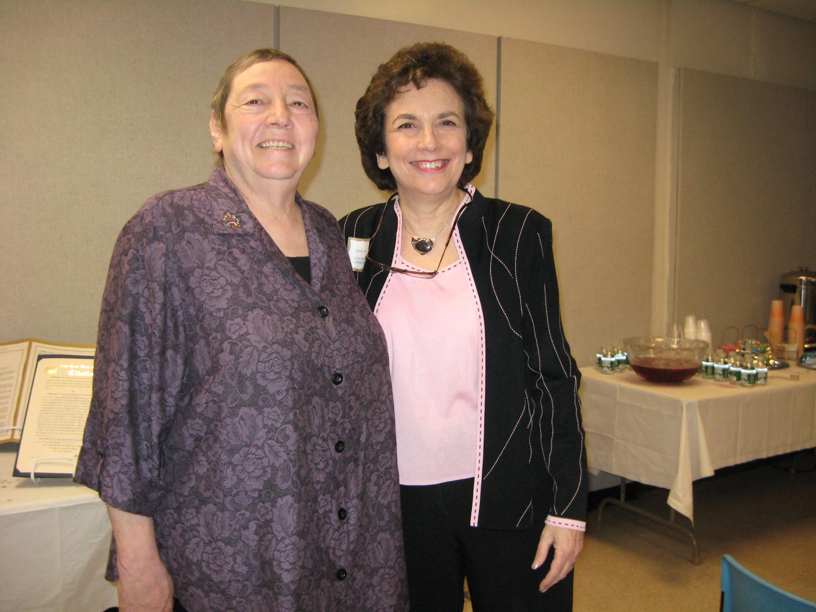 Image of board member Renee Steinig with the president of the school board attending the Half Hollow Hills Community Library's 50th Birthday celebration in April 2009