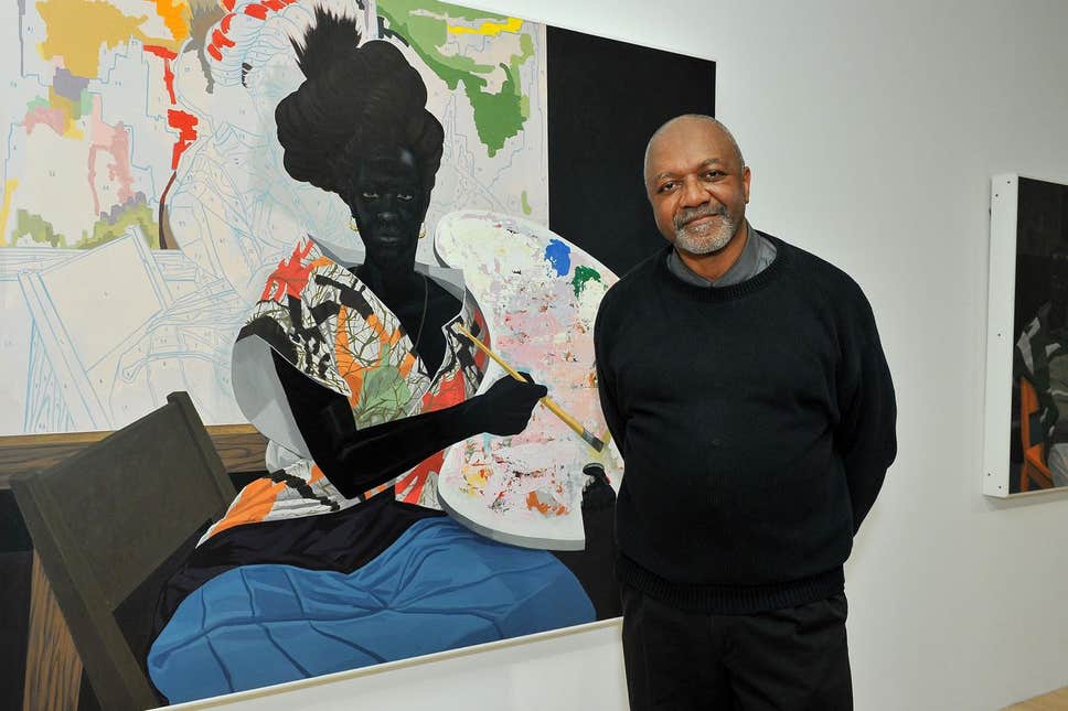Picture of Kerry James Marshall in front of one of his paintings.
