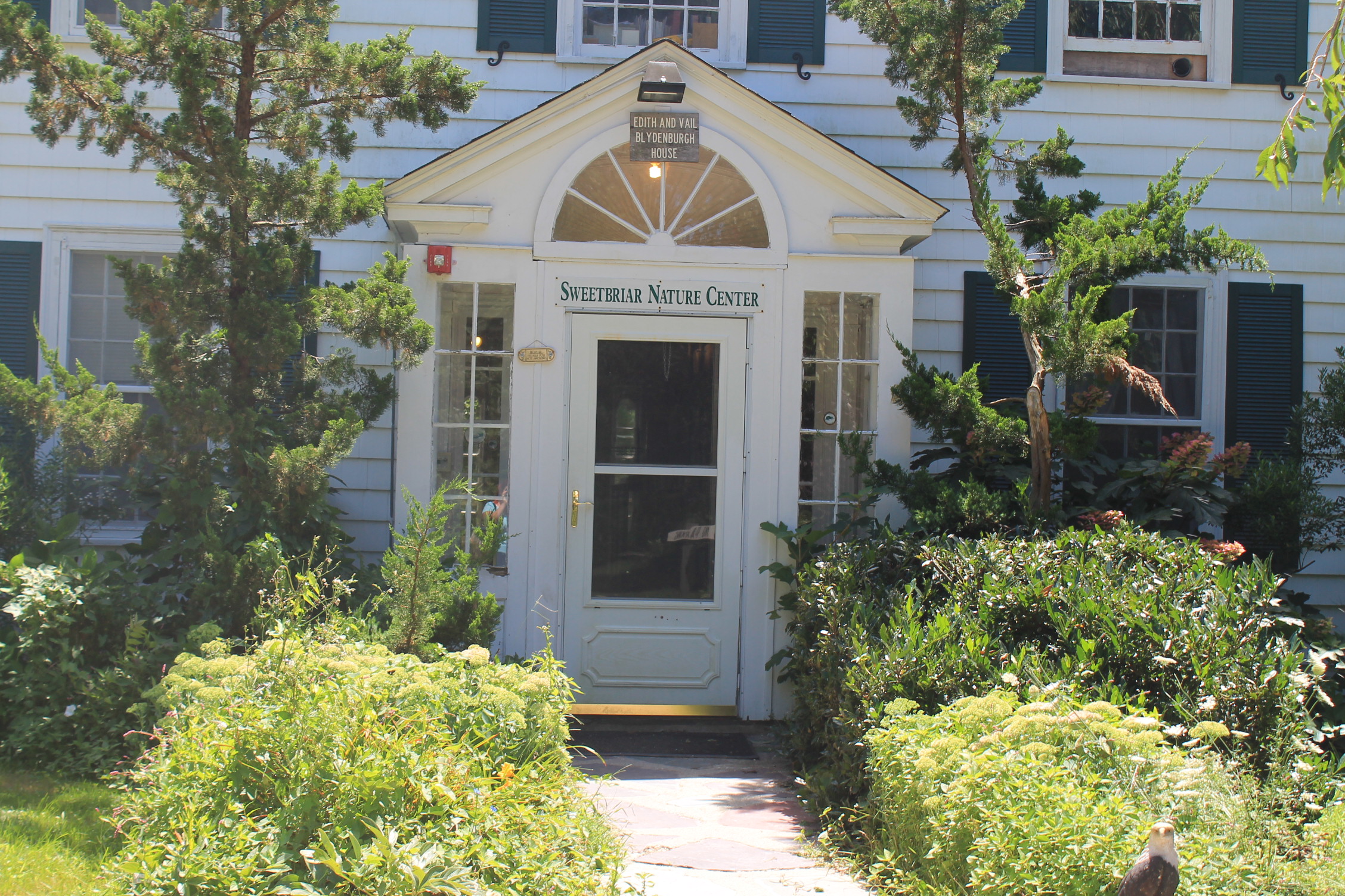 Photograph of the front entrance of the Sweetbriar Nature Center in Smithtown, NY. 