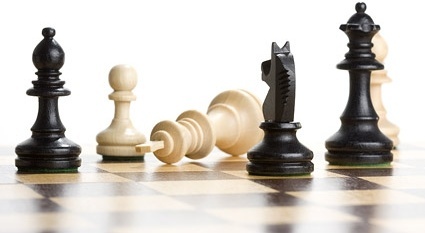 Image of chess pieces on a board.
