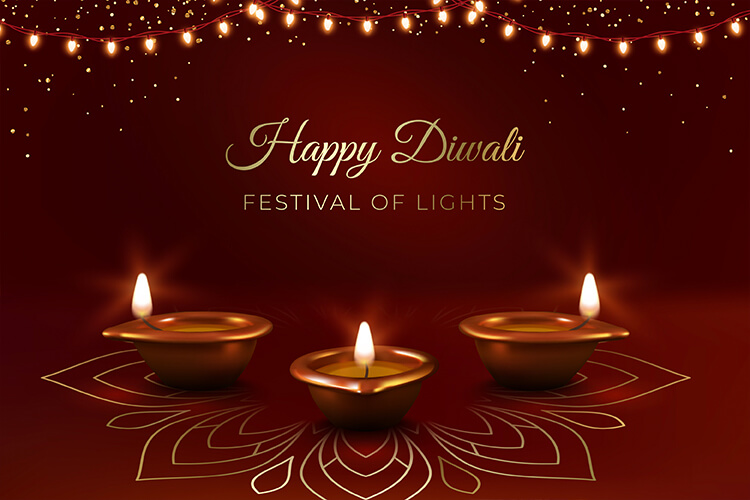 3 lit candles and a garland of lights with the words Happy Diwali, Festival of Lights written out. 