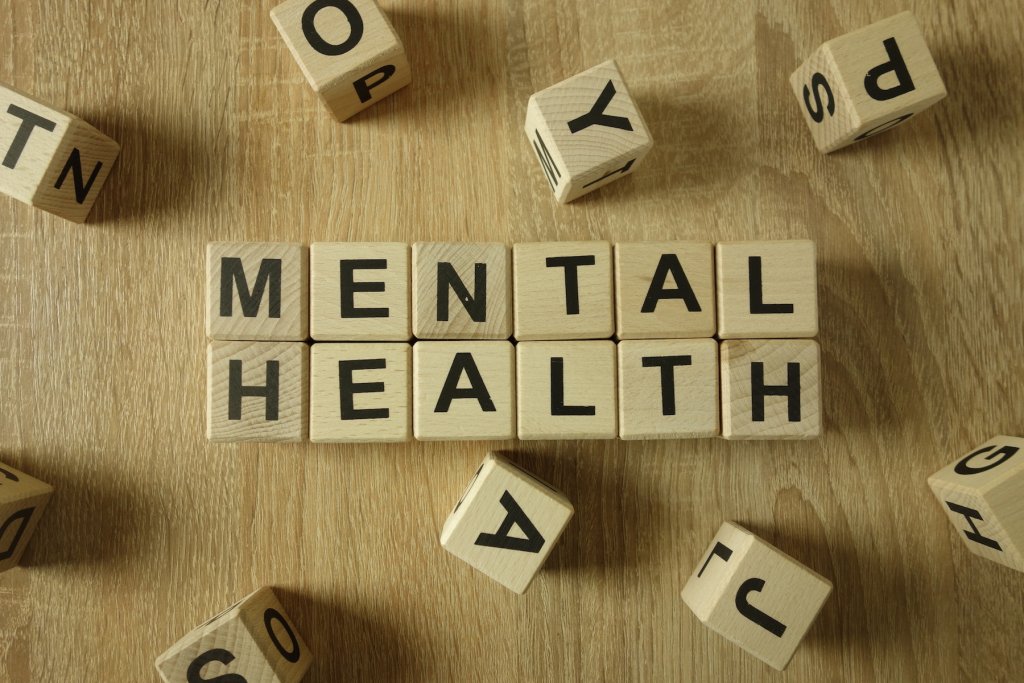 Image of wooden cubes with letters on them turned to spell out "Mental Health"