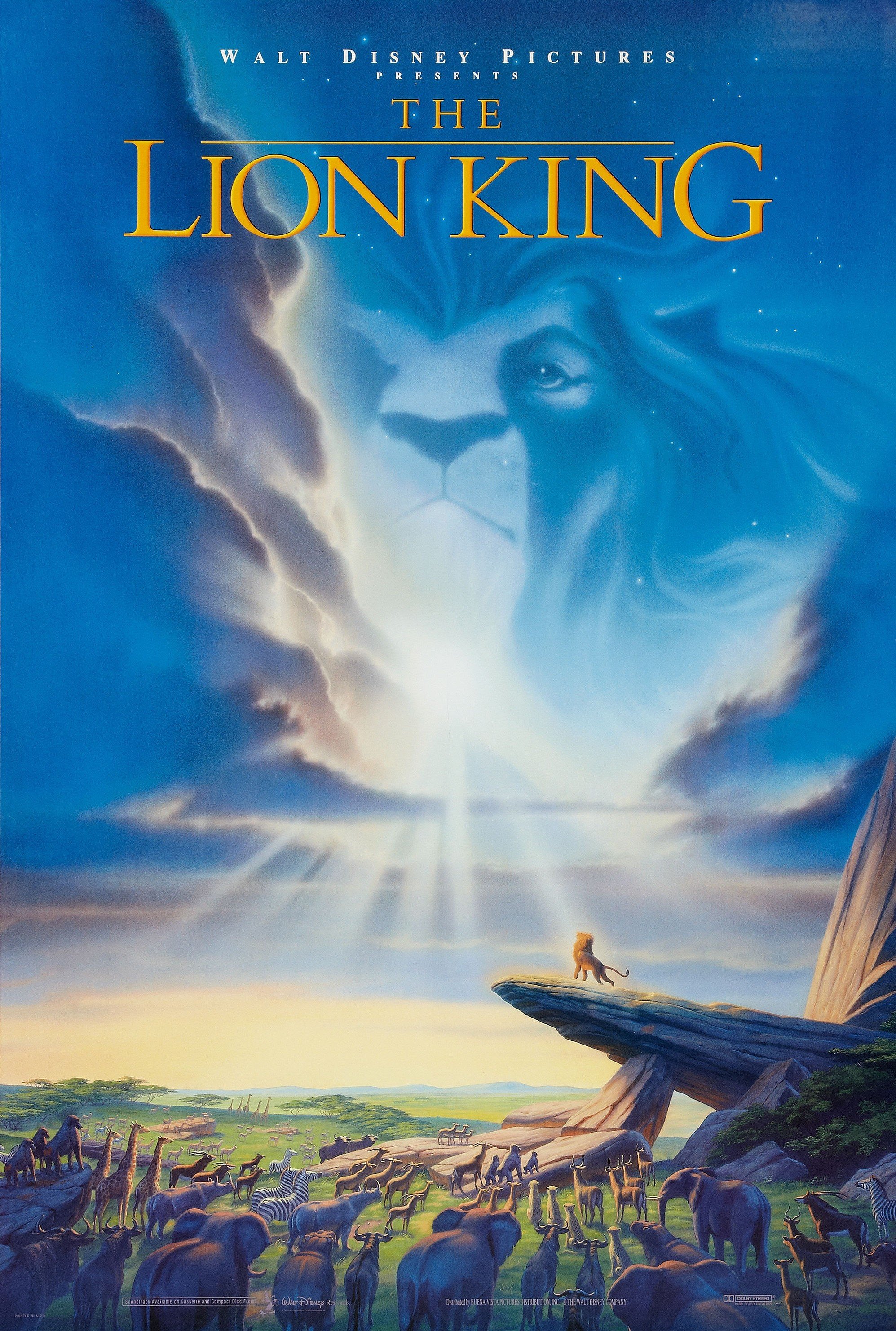 Image of the movie cover featuring a Lion standing on a cliff looking up at an image of a lion looking down from the sky. Many types of Jungle animals below the cliff looking up to the sky as well.
