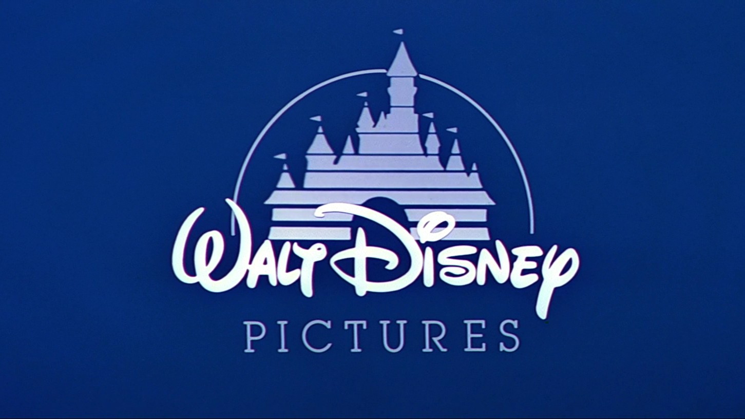 image of the Walt Disney Pictures logo on top of a blue background. Logo features a blue castle with an arcing line on top, with a white font.