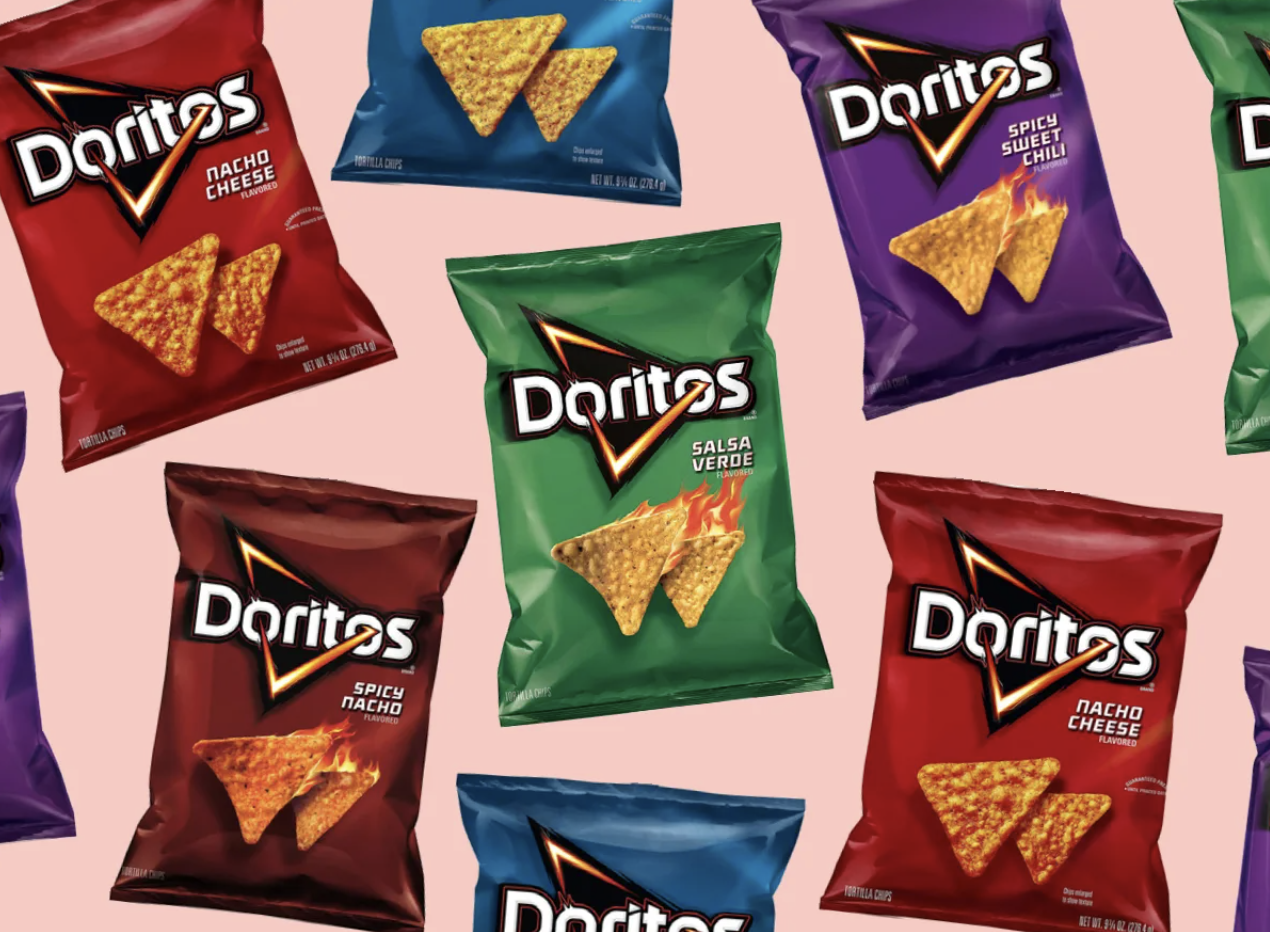 image of different varying flavors of Doritos over a pink background. Flavors include salsa verde, spicy nacho, nacho cheese, and spicy sweet chili, and cool ranch.