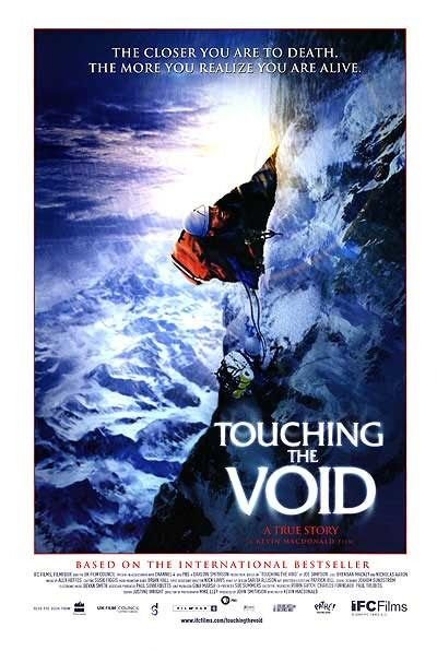 Image of the movie poster. Man climbing the side of a snow covered mountain. 