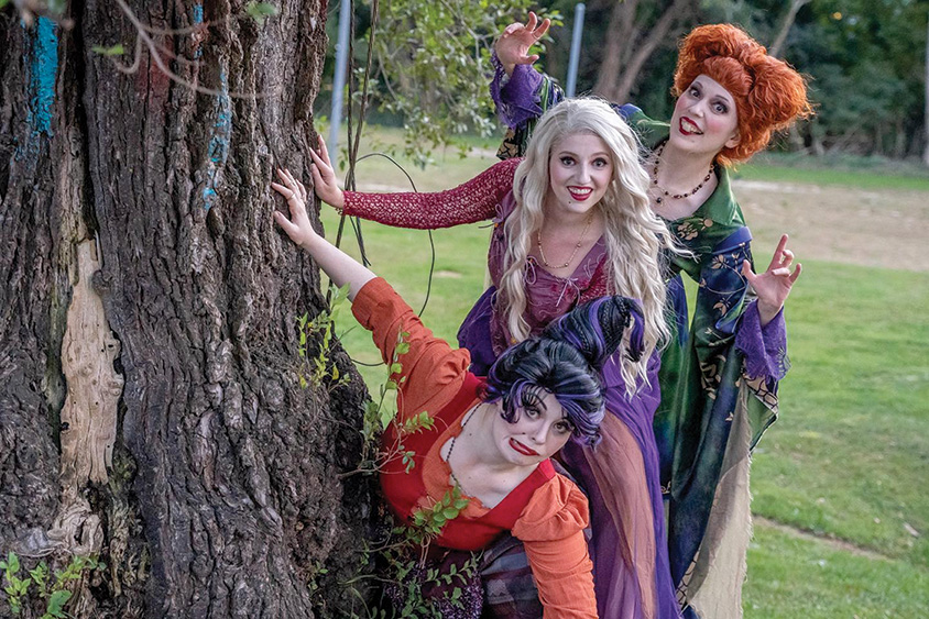 Image of 3 actresses dressed up as the 3 Sanderson sisters from the movie Hocus Pocus 2. 
