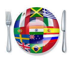 Different images of flags on a graphic of a plate with a knife and fork at its sides.
