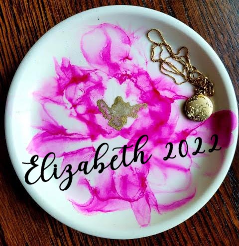 Image of the craft featuring a white plate with bright purple ink in a design. 