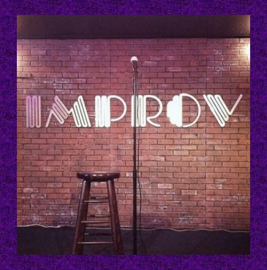 Image of a brick wall with a standing microphone in front of it as well as a brown stool. The word IMPROV is hung on the wall in big bold letters, and a purple border surrounds the whole image. 