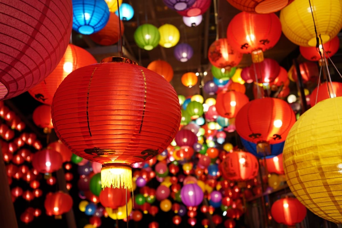 Image of Chinese Lanterns, mostly red, but some yellow and blue.