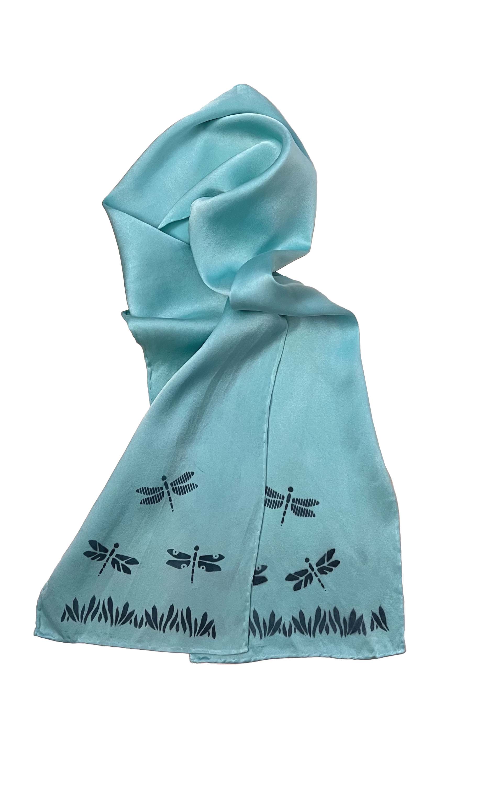 Image of the craft which is a light blue scarf with dragonflies printed on it. 