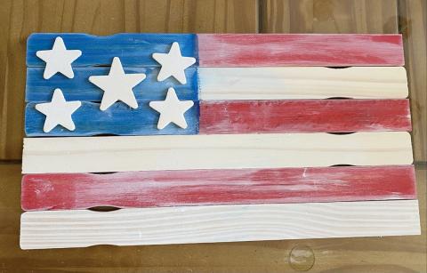 Image of the project. A modified American Flag on wood pallet. 