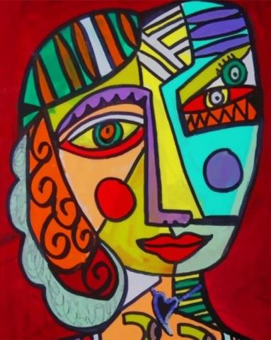 Image of a Picasso painting of a face with sharp angles and colors.
