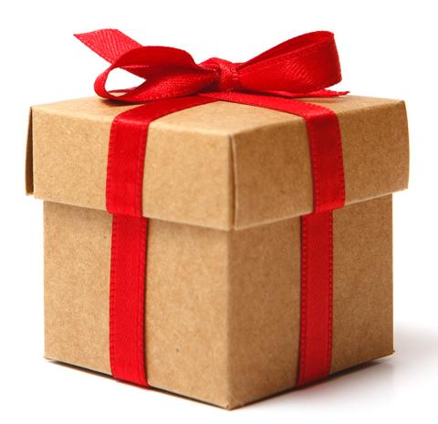 Image of a gift. Brown cube box with a red ribbon tied in a bow. 