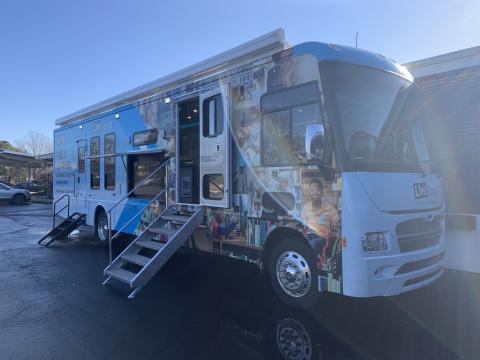 Big winnebago that serves as a mobile library.