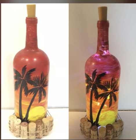 Image of the craft: Wine bottle painted in red, orange and yellow with palm trees, and wine corks around the bottom on the outside of the bottle. One of the bottles has a string of led lights to create a glow on the inside of the bottle. 
