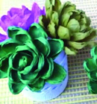 Image of the craft featuring 3 succulent plants made out of crepe paper.