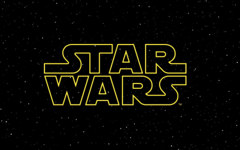 Star Wars Logo in yellow over a starry black and white sky