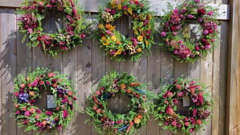 Image of the craft featuring different dried flower and herb wreaths