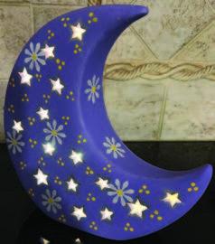 Image of the craft featuring a ceramic crescent shaped moon painted.