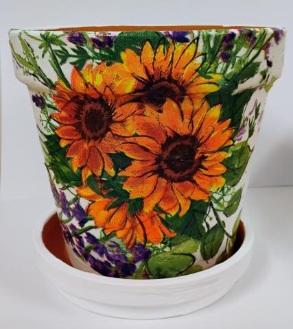 Image of the craft featuring a planter with flowers imprinted on it. 