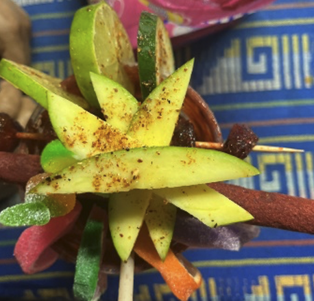 Mangonadas, which is a stick of limes and other fruits.