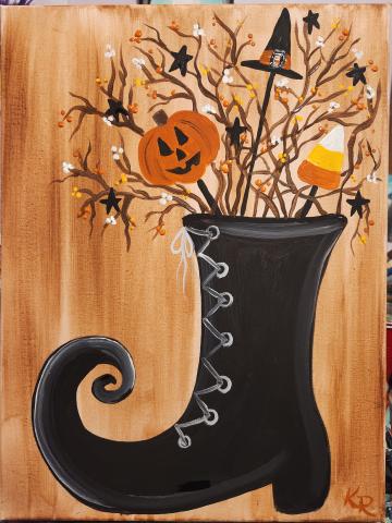 Image of the craft. Painted canvas with a witch boot filled with sticks and Halloween Decorations. 