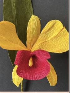 Image of the craft featuring an orchid made out of crepe paper