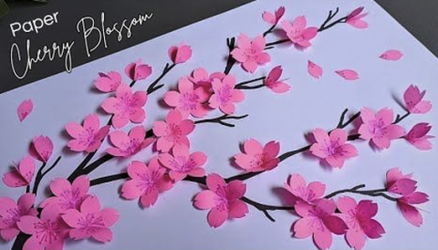 Paper cut outs of cherry blossoms.