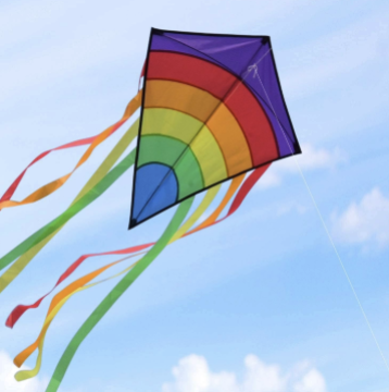 Rainbow kite flying in the sky.