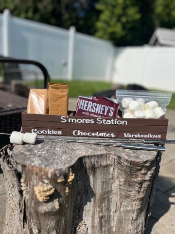 Image of a wooden basket with sections for the different ingredients to make s'mores