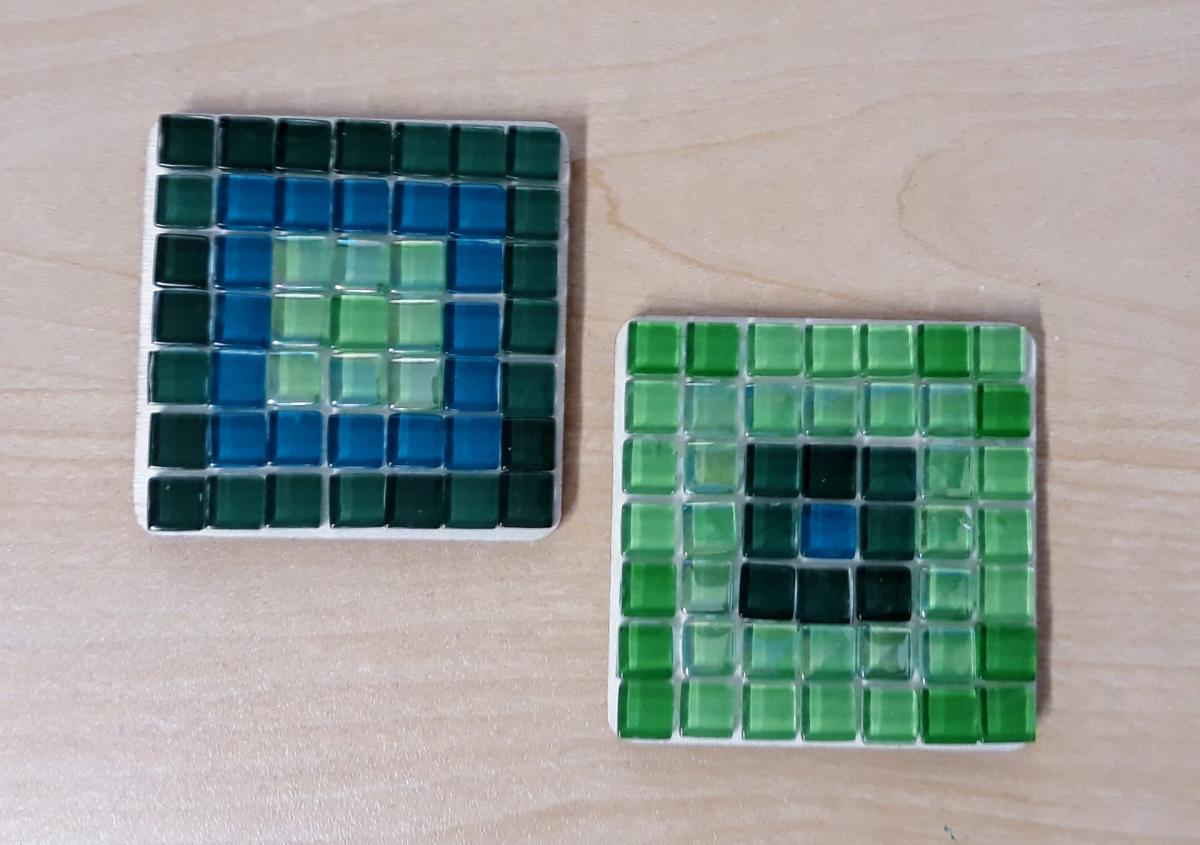 Image of the craft featuring small square tiles in a square shape to create a coaster. 