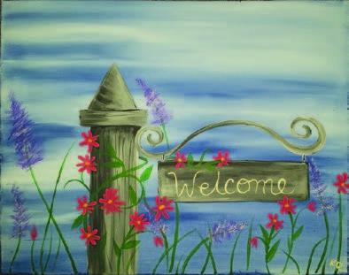 Image of the craft with a decorative post with a welcome sign. Red flowers are around the post. 