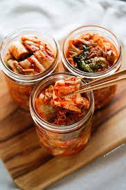 Image of 3 glass mason jars filled with Kimchi