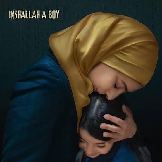 A mother holding a young child