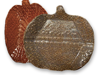 Image of the craft featuring a dark orange and dark brown ceramic plate in the shape of a pumpkin.