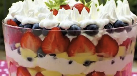 Fruit trifle with strawberries and blueberries.