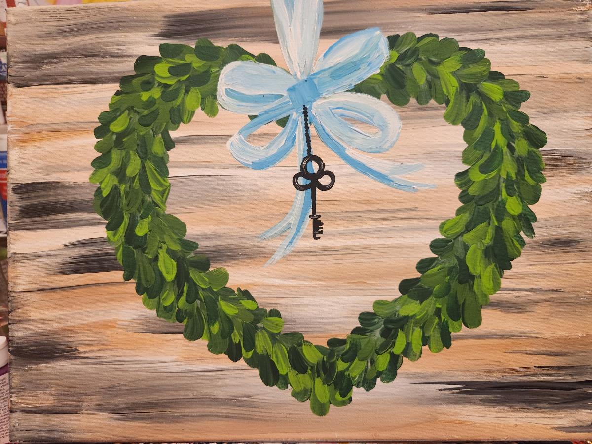 Image of a painted canvas featuring a heart with a bow and key. 