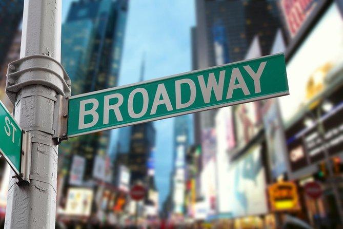 Photo of a street sign in NYC that says Broadway and building images blurred in the background.