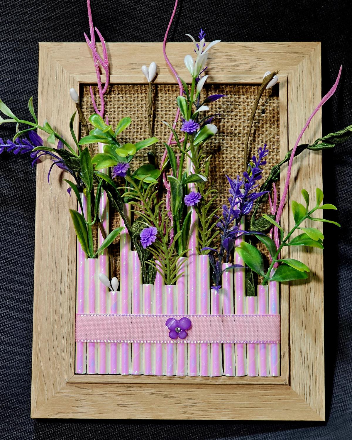 Image of the craft featuring a wood board with faux wild flowers attached ribbon