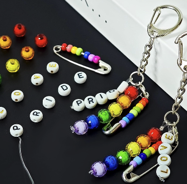 Rainbow pride bracelets and keychains with rainbow beads.